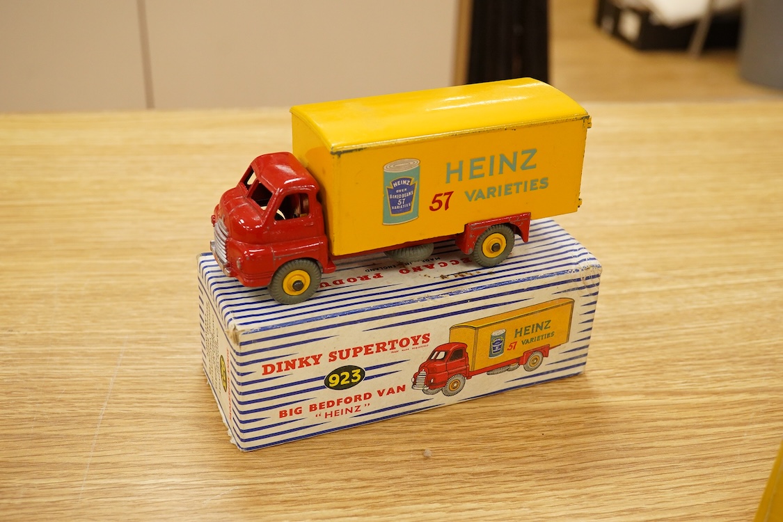 Nine Dinky Toys; Big Bedford Heinz van (923), Austin Atlantic Convertible (106), Austin-Healey 100 (109), M.G. Midget (108), Cunningham C-5R (133), Motocart (342), Austin Champ (674), Army Covered Wagon (623), and Army 1